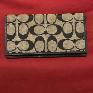 Black fabric coach check book